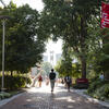 Temple student waling on the main campus