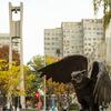 Campus in the fall, showing the bell tower and owl statue