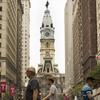 Temple University flags line the street leading to Philadelphia City Hall.