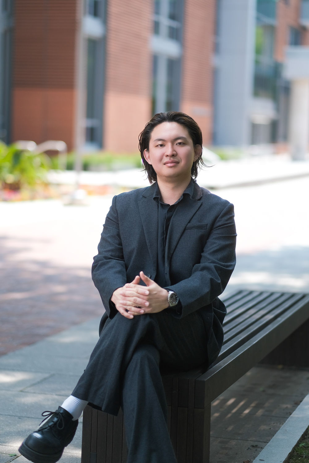 Kanghyun (Simon) Cho sitting on campus